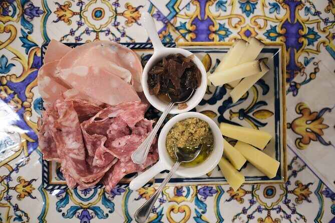 Guided Food Tour with Wine Tasting in Verona - Stop 1 near Castelvecchio: cured ham, cheeses, and Sicilian vegetable patés